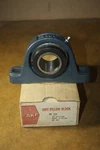 Nos Skf SY-107 Series Pillow Block Bearing For 1-7/16 Inch Shaft. Fixed Price $149.99.